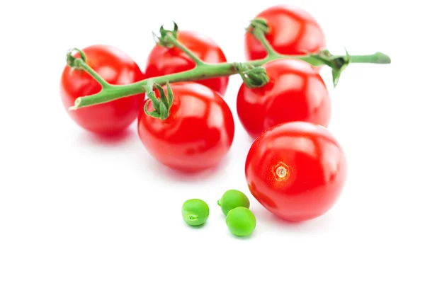 Bunch of tomato and peas isolated on white — Stock Photo, Image
