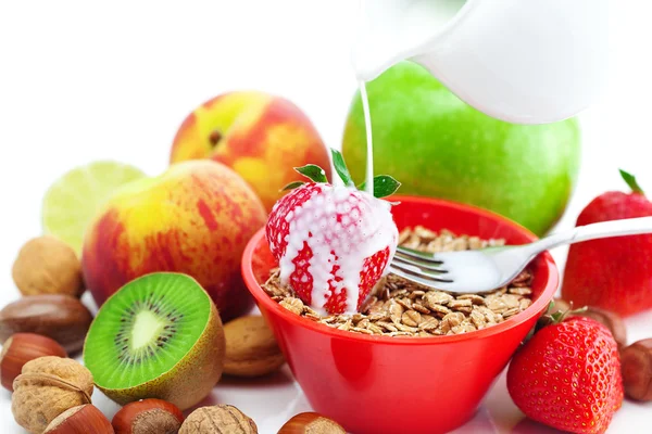 Strawberry, peach, apple, kiwi, fork, milk,nuts and wheat in a b — Stock Photo, Image