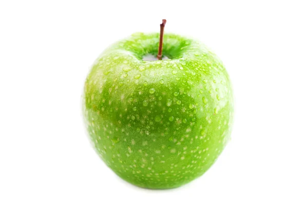 Gran manzana verde con gotas de agua aislados en blanco — Stockfoto