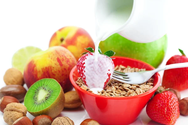 Strawberry, peach, apple, kiwi, fork, milk,nuts and wheat in a b — Stock Photo, Image