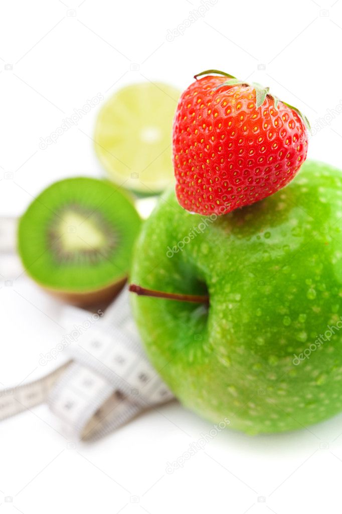Strawberries,apple with water drops,kiwi and measure tape isolat
