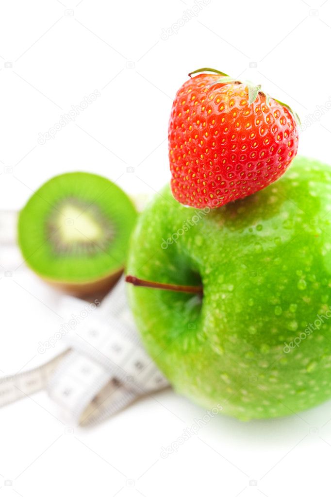 Strawberries,apple with water drops,kiwi and measure tape isolat