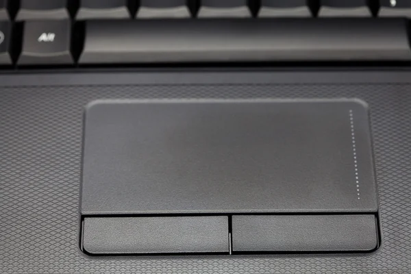 Touchpad e teclado laptop close-up — Fotografia de Stock