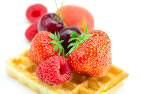 Waffles, cherry, strawberry, apricot and raspberry isolated on w — Stock Photo, Image