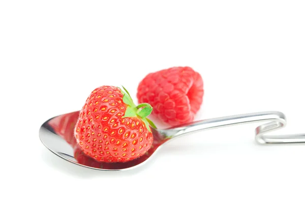 Spoon, strawberries and raspberries isolated on white — Stock Photo, Image