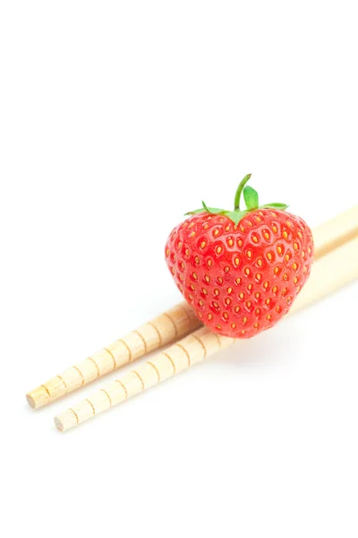 Strawberry and chopsticks isolated on white — Stock Photo, Image