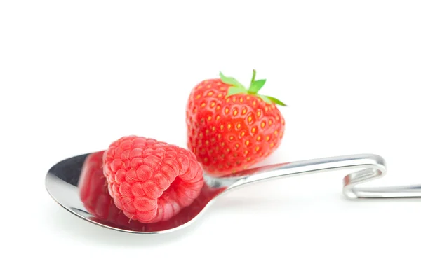 Spoon, strawberries and raspberries isolated on white — Stock Photo, Image
