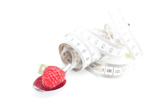 Raspberry and measure tape isolated on white — Stock Photo, Image