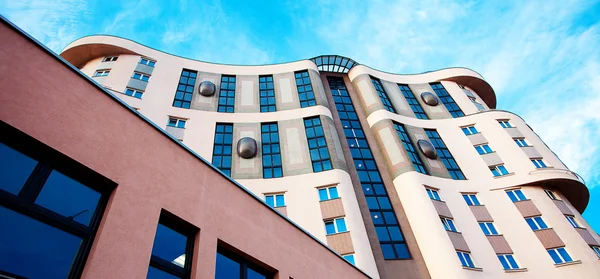 stock image Modern office building against the blue sky