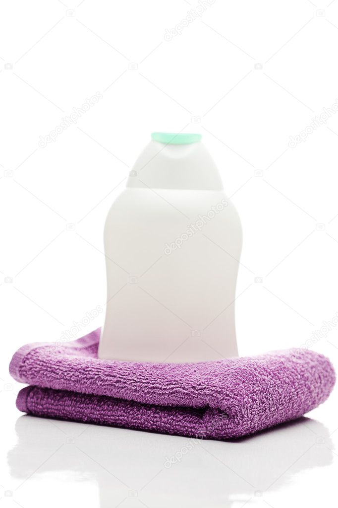 Cosmetic containers and towel isolated on white