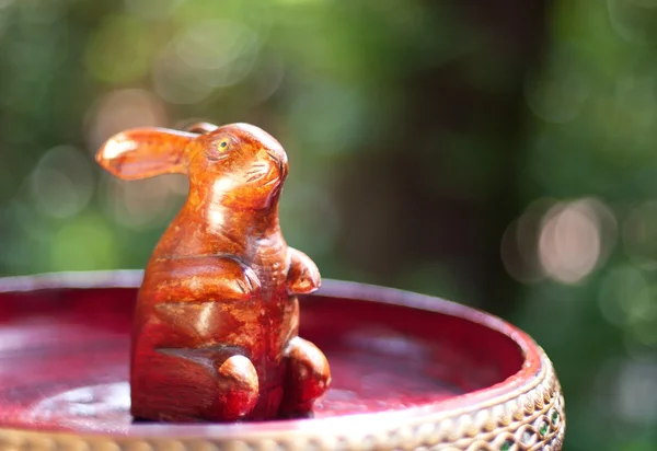 stock image Wooden rabbit toy on traditional thai tray