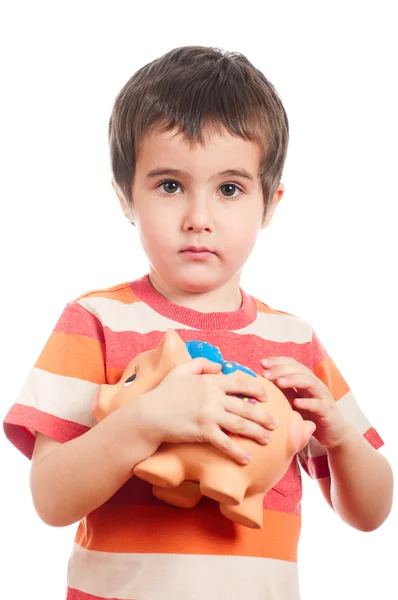 Pequeno menino com porquinho banco — Fotografia de Stock