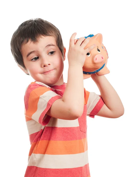 Kleine jongen schudden de piggy bank — Stockfoto