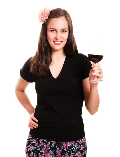Krásná dívka s květinou ve vlasech drží sklenku vína — Stock fotografie