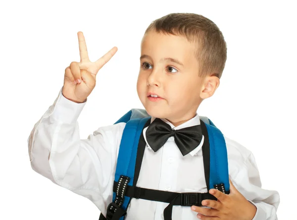 Portret van basisschool jongen overwinning teken weergegeven: — Stockfoto