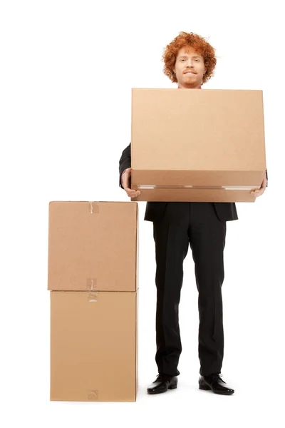 Atractivo hombre de negocios con grandes cajas —  Fotos de Stock