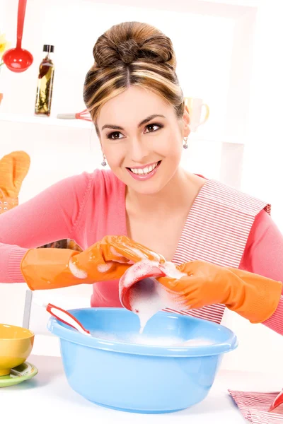 Housewife washing dish — Stock Photo, Image
