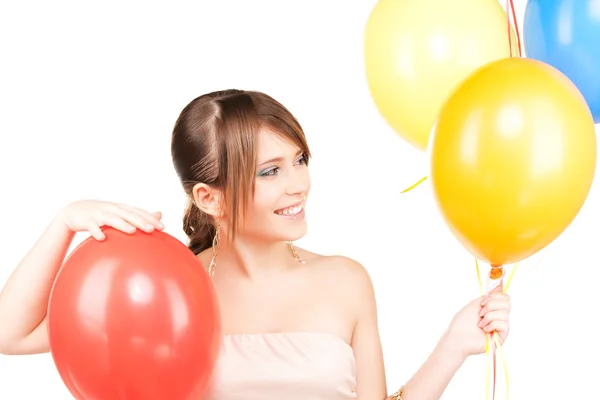 Happy teenage girl with balloons — Stock Photo, Image