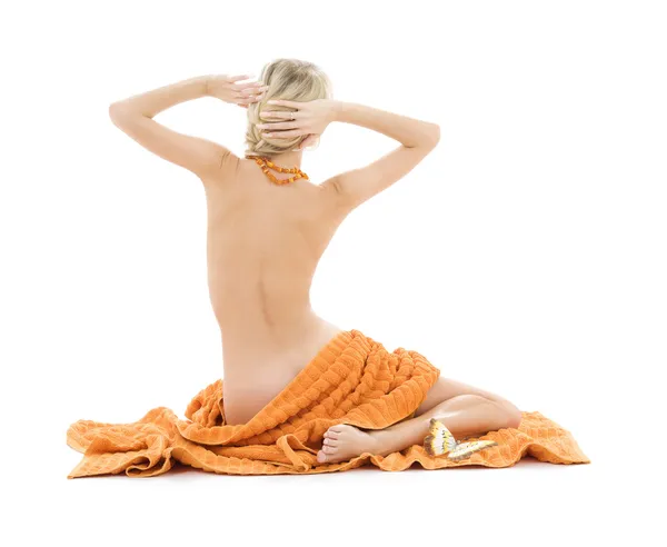 Linda senhora com toalhas de laranja — Fotografia de Stock