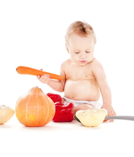 Baby boy with vegetables — Stock Photo, Image