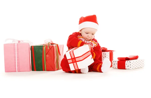 Weihnachtsmann-Helferbaby mit Weihnachtsgeschenken — Stockfoto