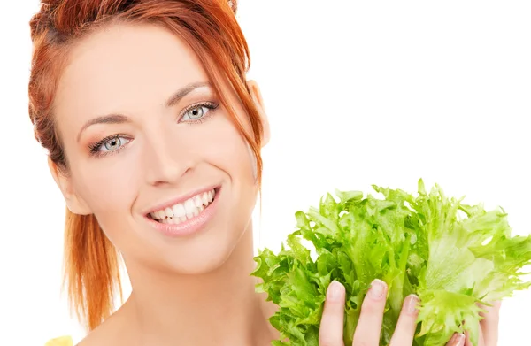 Happy woman with lettuce Royalty Free Stock Photos