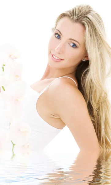 Blonde in cotton underwear with orchid — Stock Photo, Image