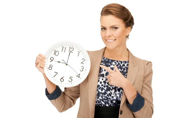 Жінка тримає великий годинник — стокове фото