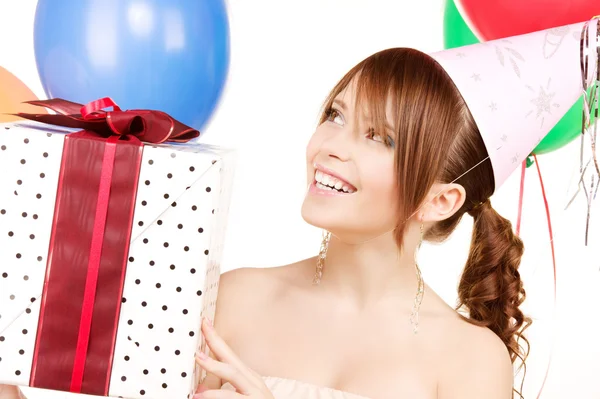 Party girl with balloons and gift box Stock Photo