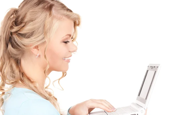便携式计算机的幸福女人 免版税图库照片