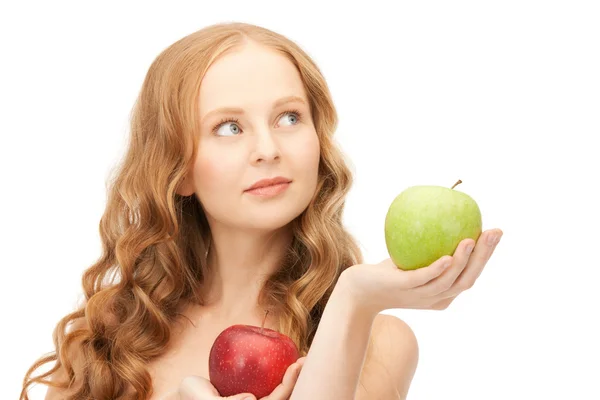 Young beautiful woman with green and red apples Stock Picture