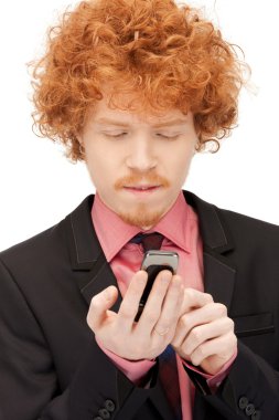 Handsome man with cell phone clipart