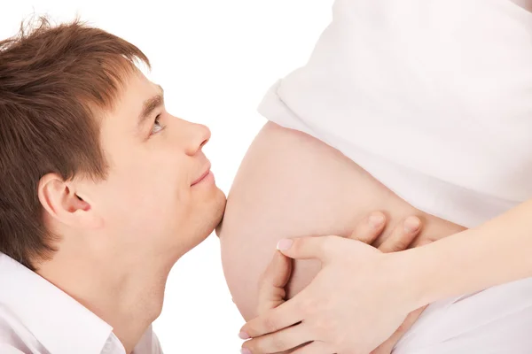 Männliches Gesicht und Schwangerschaftsbauch — Stockfoto