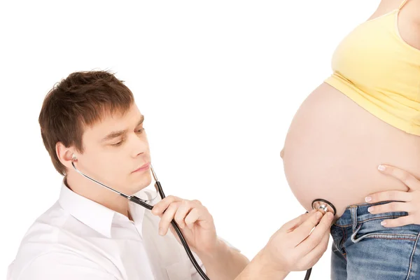 Médico y vientre de mujer embarazada —  Fotos de Stock