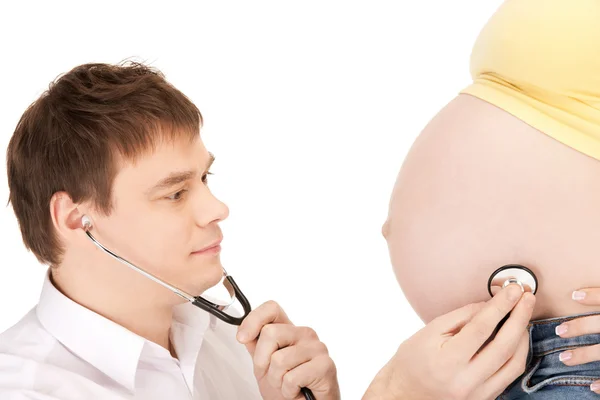 Médico e mulher grávida barriga — Fotografia de Stock