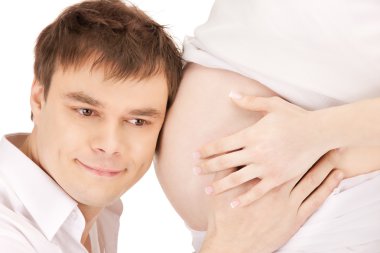 Male face and pregnant woman belly clipart