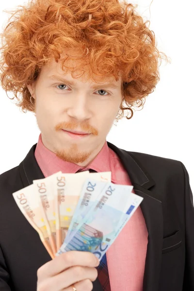 Knappe man met euro contant geld — Stockfoto