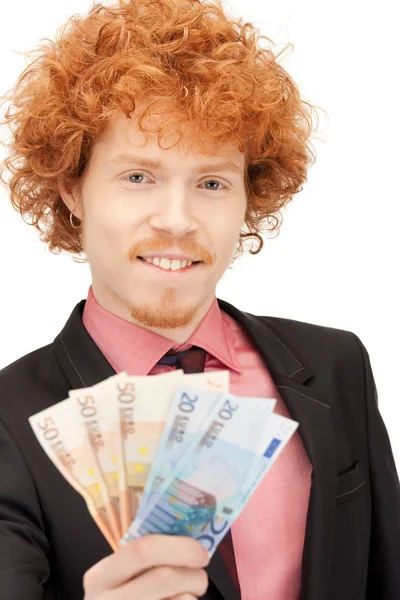 Hombre guapo con dinero en efectivo en euros —  Fotos de Stock