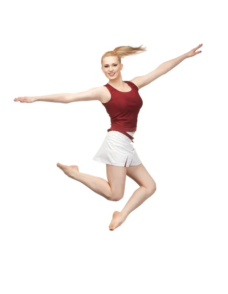 Прыгающая спортивная девушка — стоковое фото