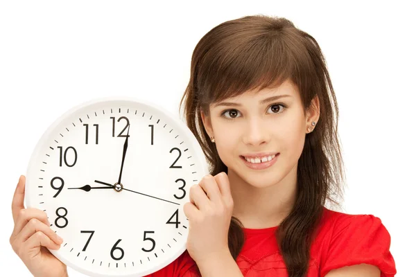 10 代の少女の持株の大時計 — ストック写真