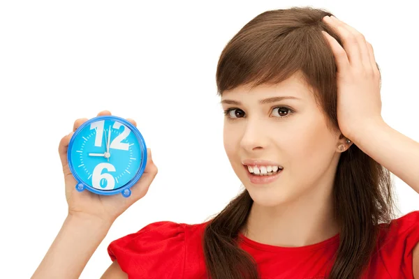 Teenage girl holding alarm clock — Stock Photo, Image