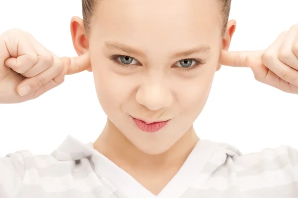 Teenage girl with fingers in ears — Stock Photo, Image