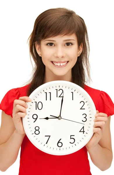 Teenage girl holding big clock — Stock Photo, Image