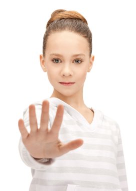 Teenage girl making stop gesture clipart
