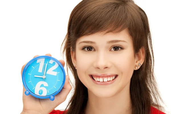Teenage girl holding alarm clock — Stock Photo, Image