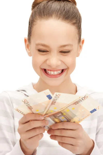 Chica adolescente con dinero en efectivo en euros —  Fotos de Stock