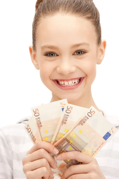 Tonårsflicka med euro i kontanter — Stockfoto