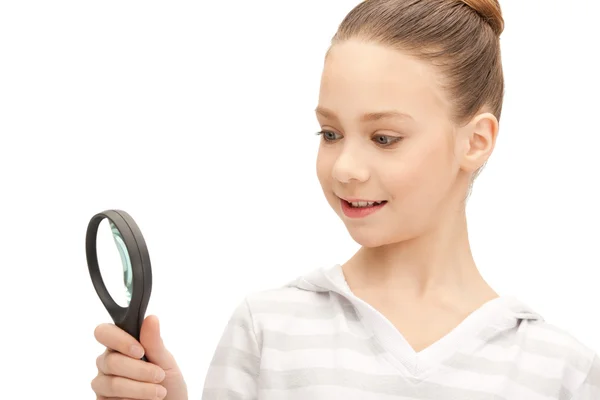 Teenage girl with magnifying glass — Stock Photo, Image