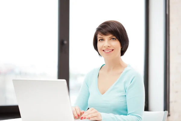Happy woman with laptop computer Royalty Free Stock Photos