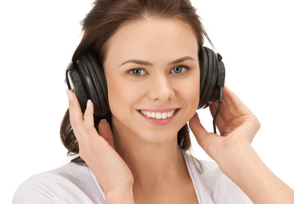 Happy teenage girl in big headphones — Stock Photo, Image